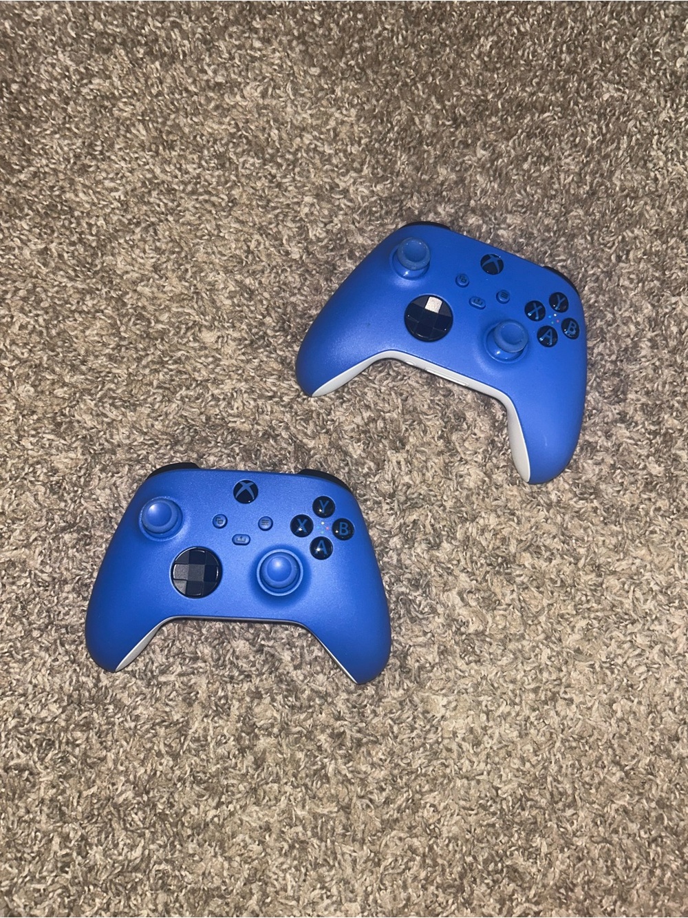 Two Blue Xbox Wireless Controllers